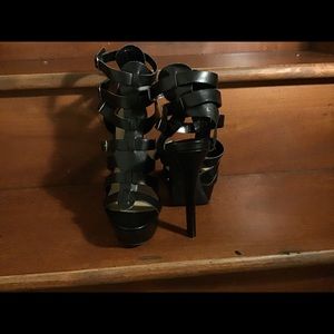 Black caged strappy 6 inch heel. 1.5 platform